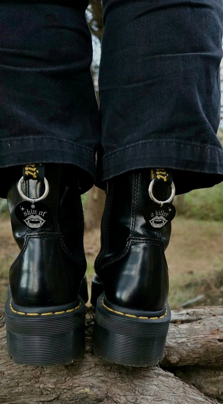 Skin of a killer dr marten charms.
