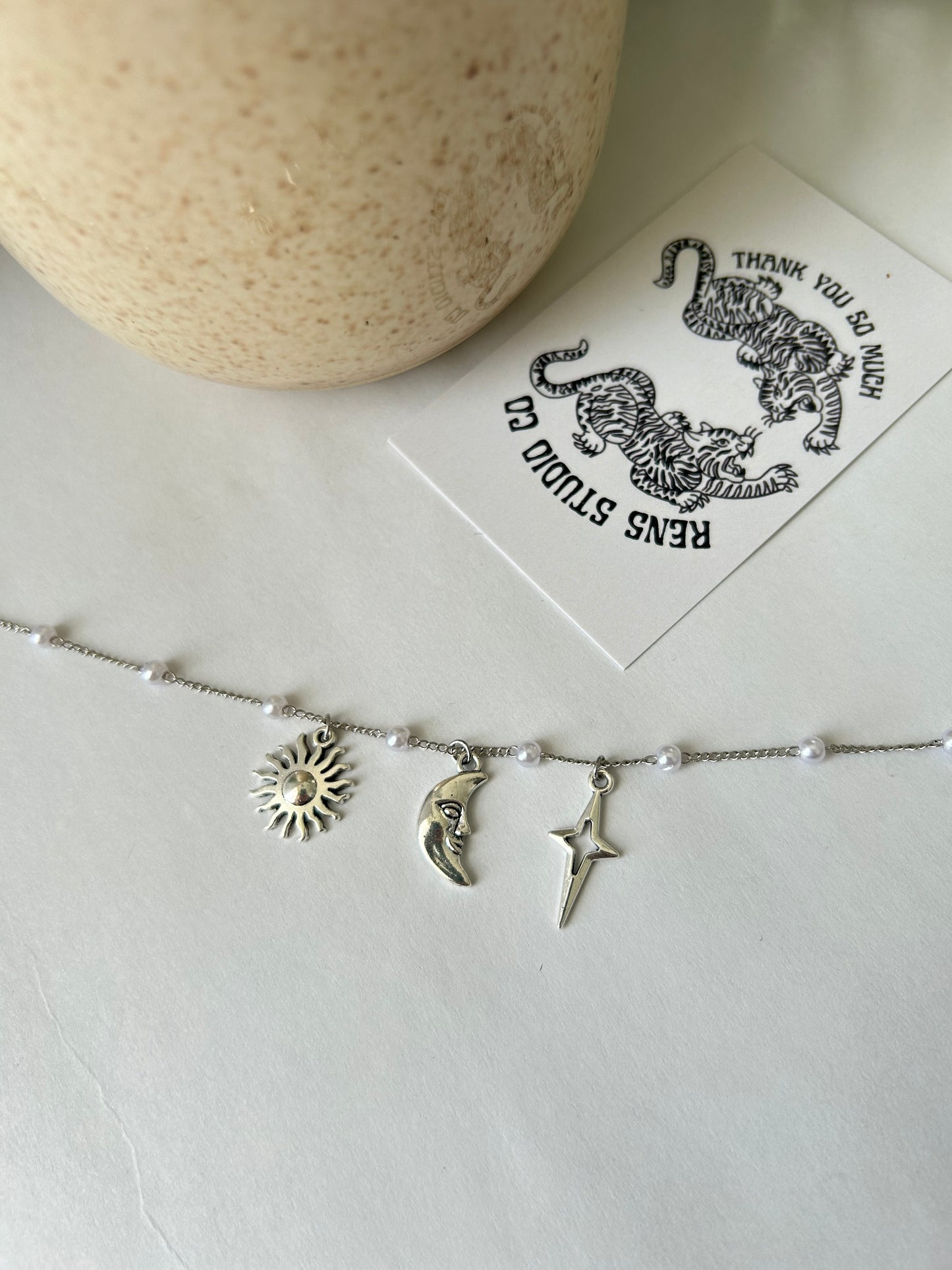 Sun moon and star pearl necklace