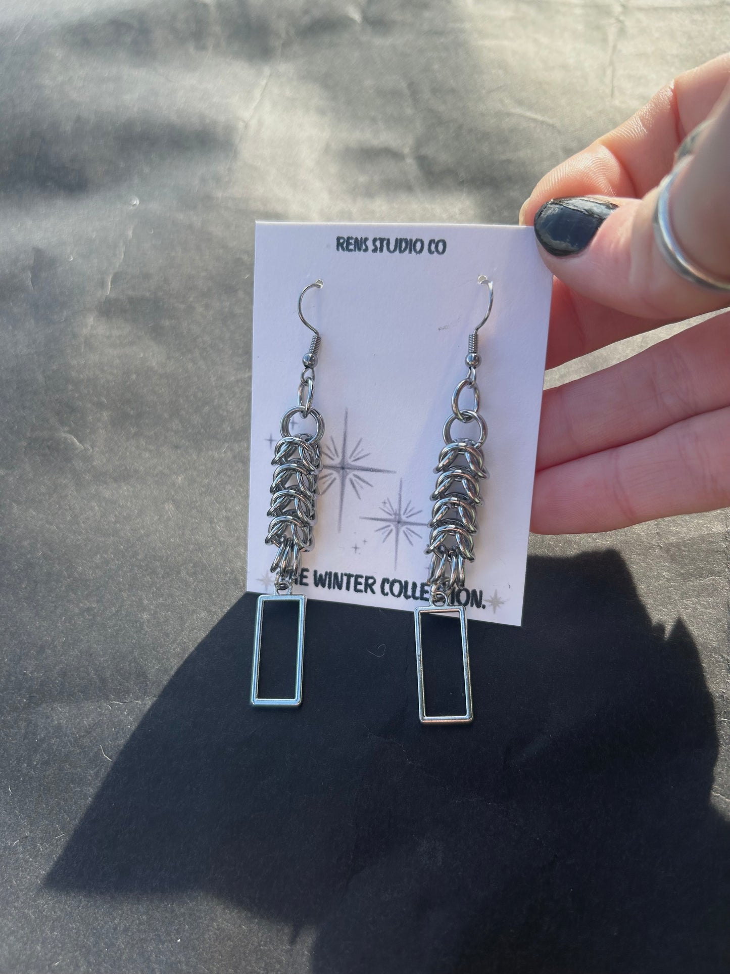boxed chain mail hook earrings.