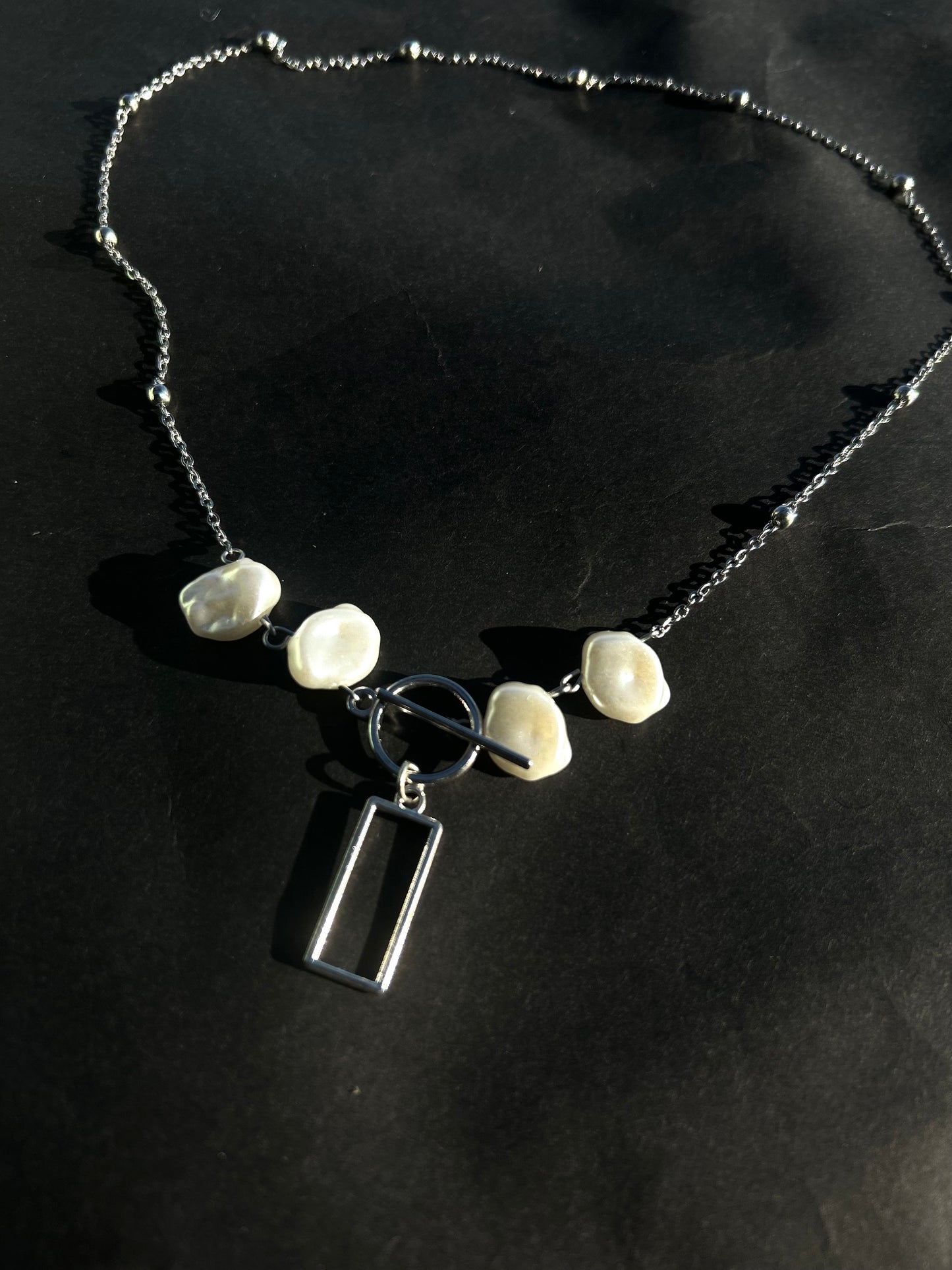 The box band necklace.