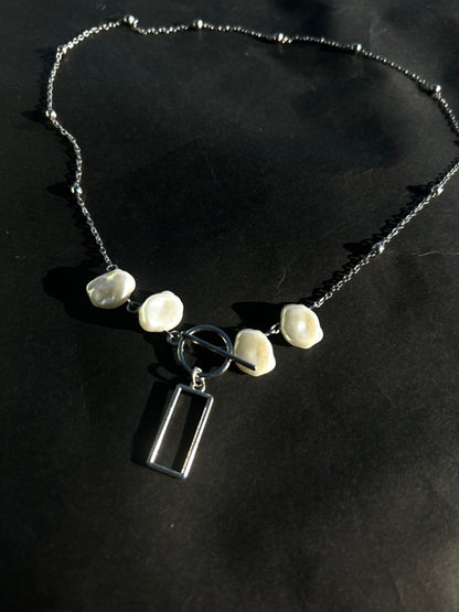 The box band necklace.