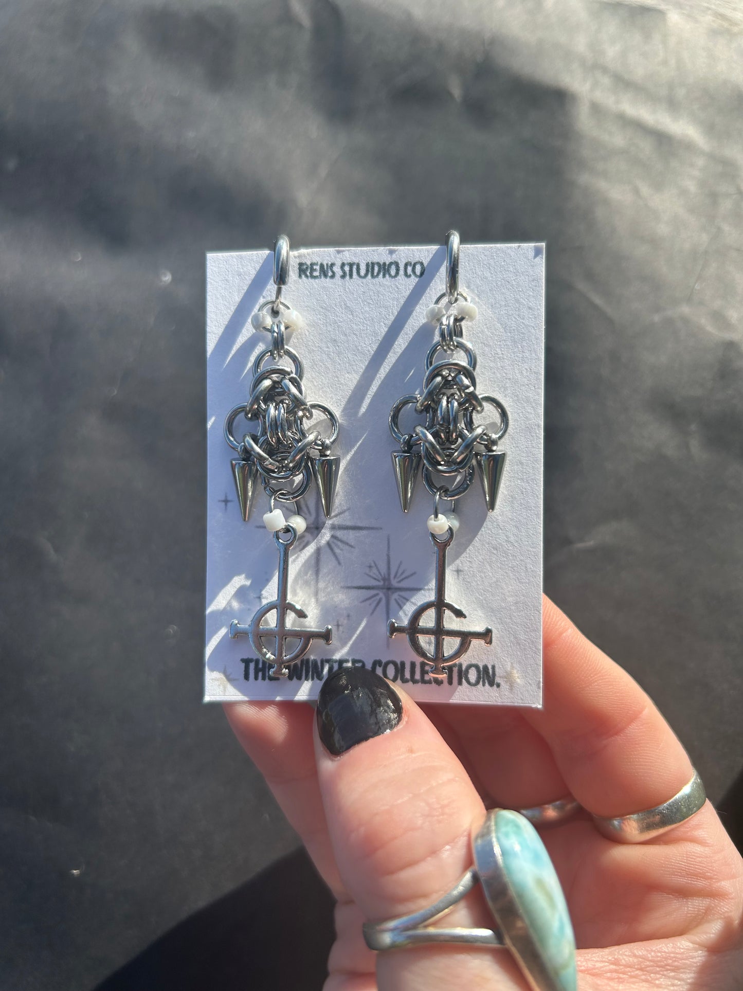 crucifix pearl chain mail earrings.