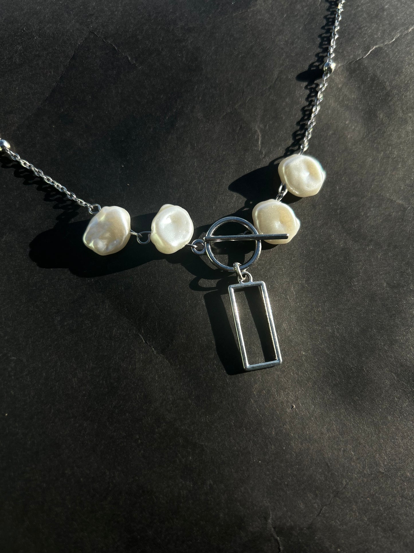 The box band necklace.