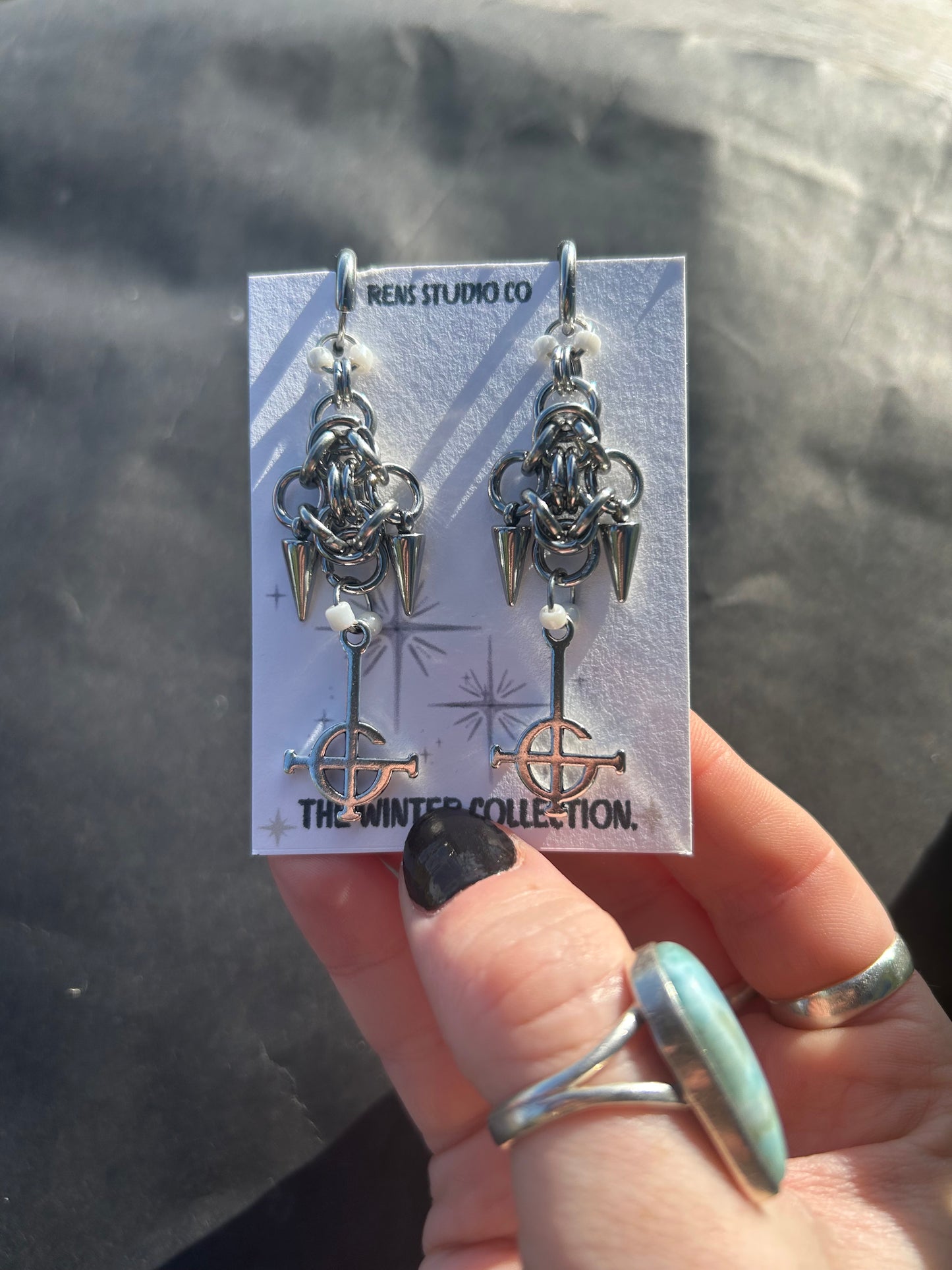 crucifix pearl chain mail earrings.