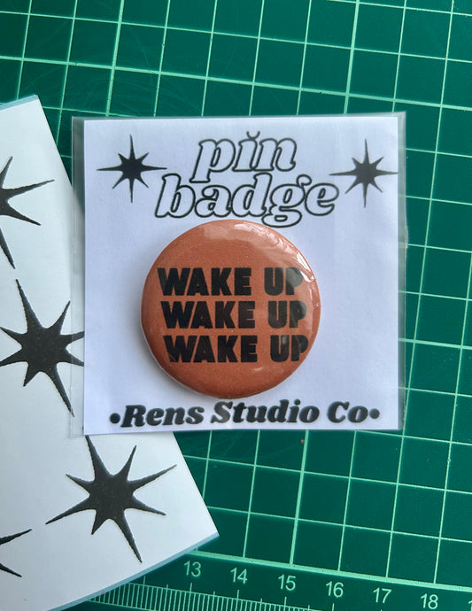 wake up pin badge