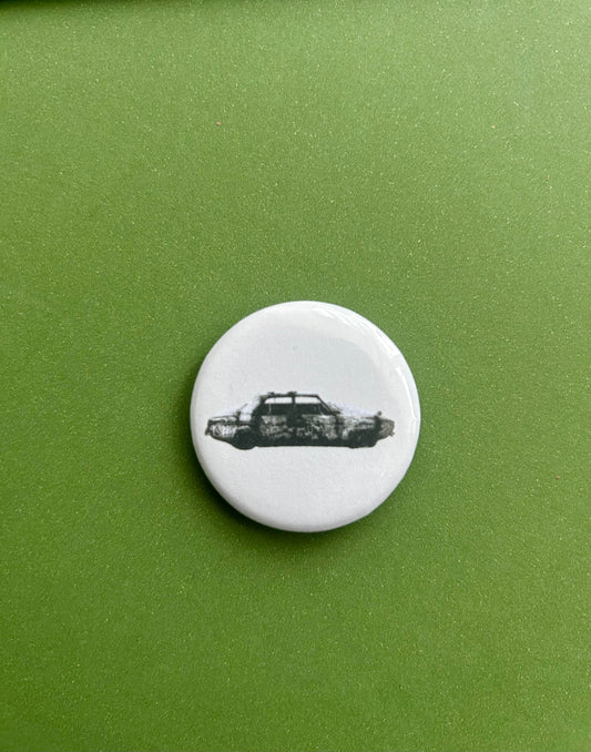 75 car pin badge