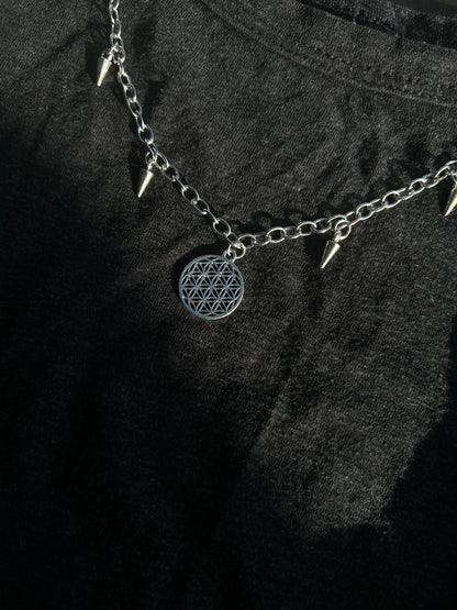 Spiked flower of life necklace.