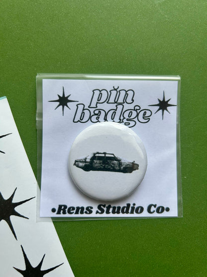 75 car pin badge
