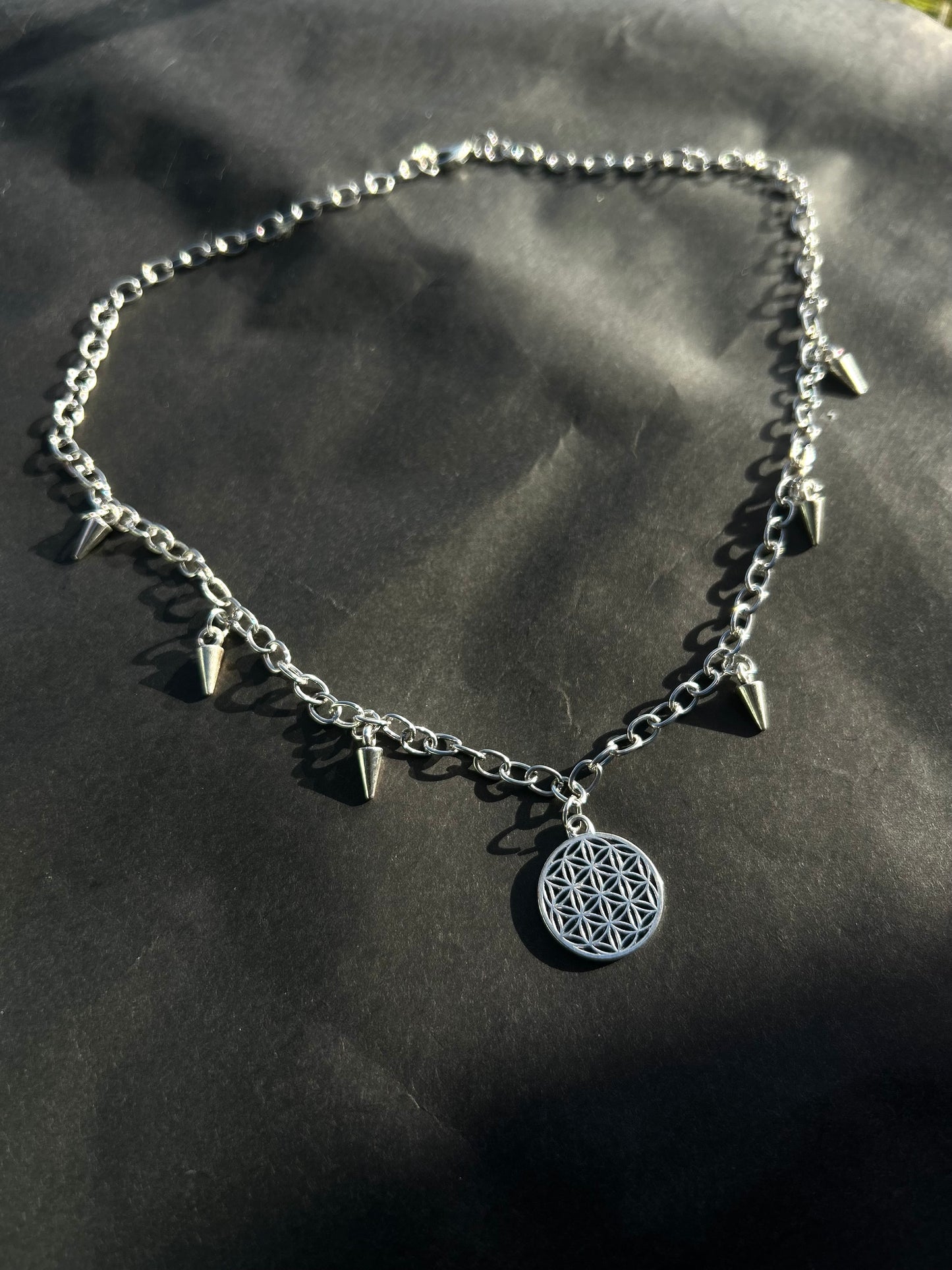Spiked flower of life necklace.