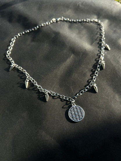 Spiked flower of life necklace.