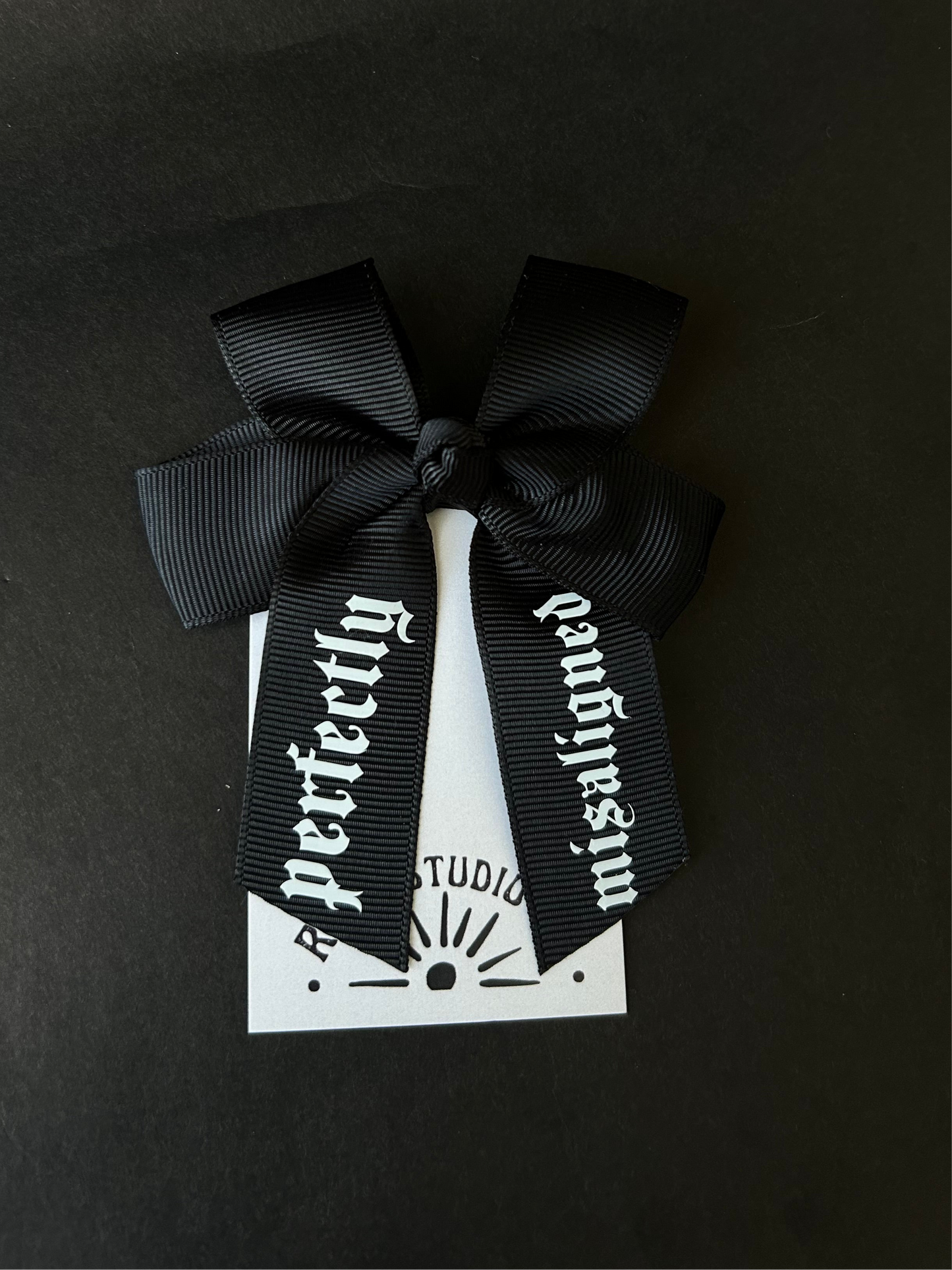 Mini misaligned hair bow