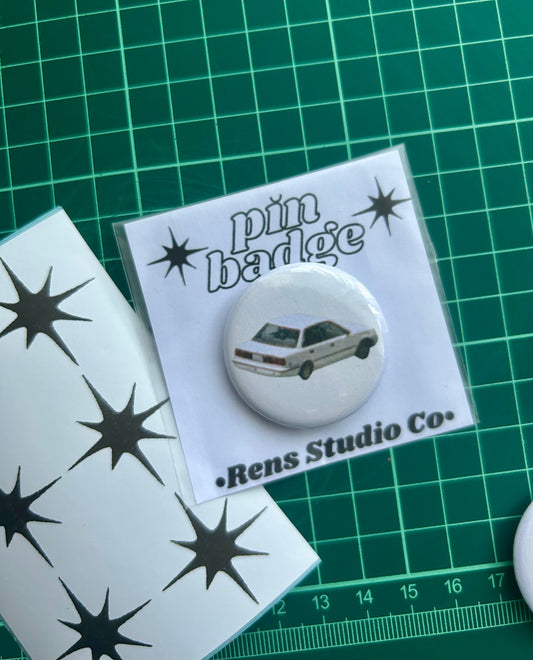 AM car pin badge