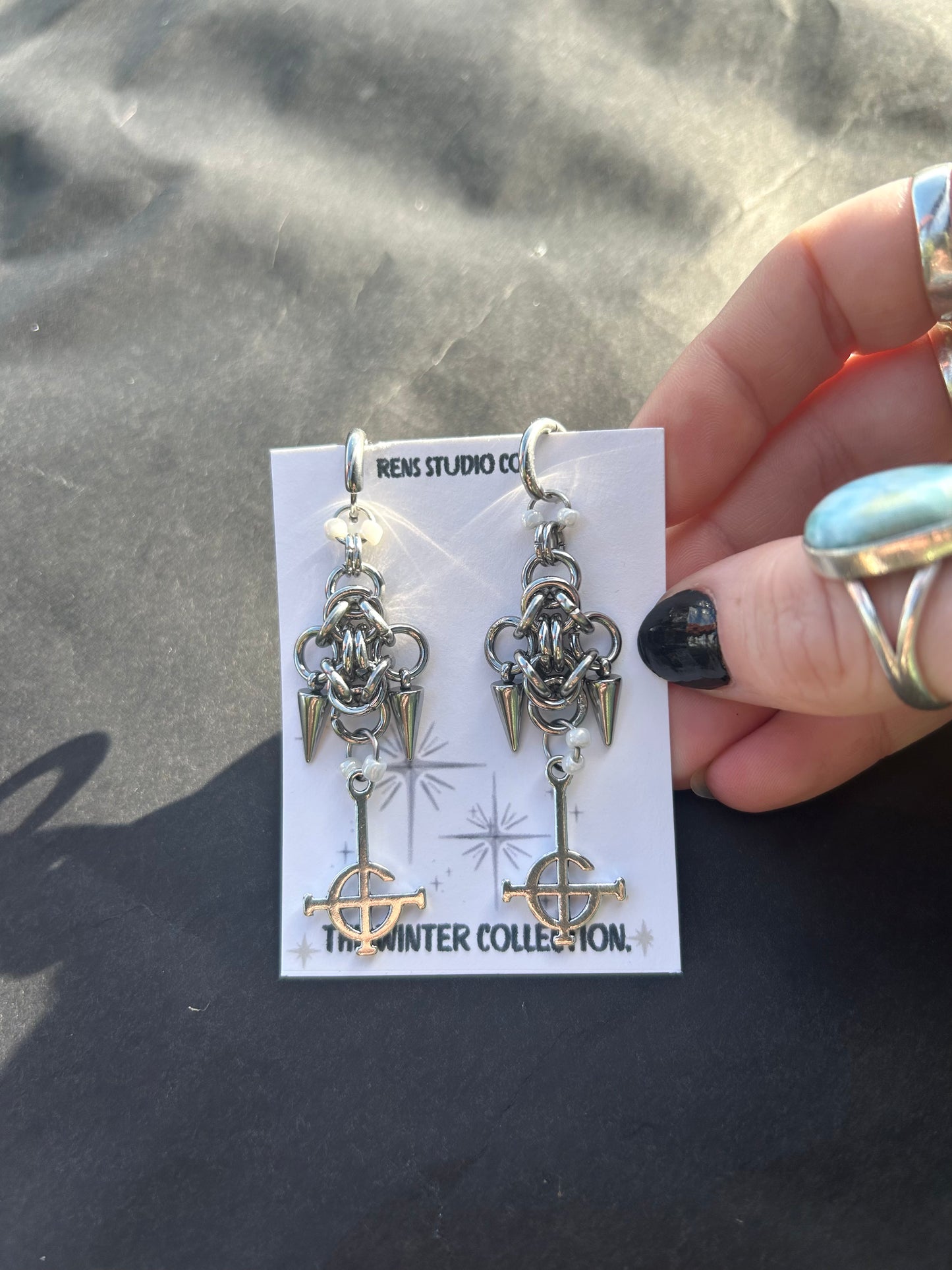 crucifix pearl chain mail earrings.