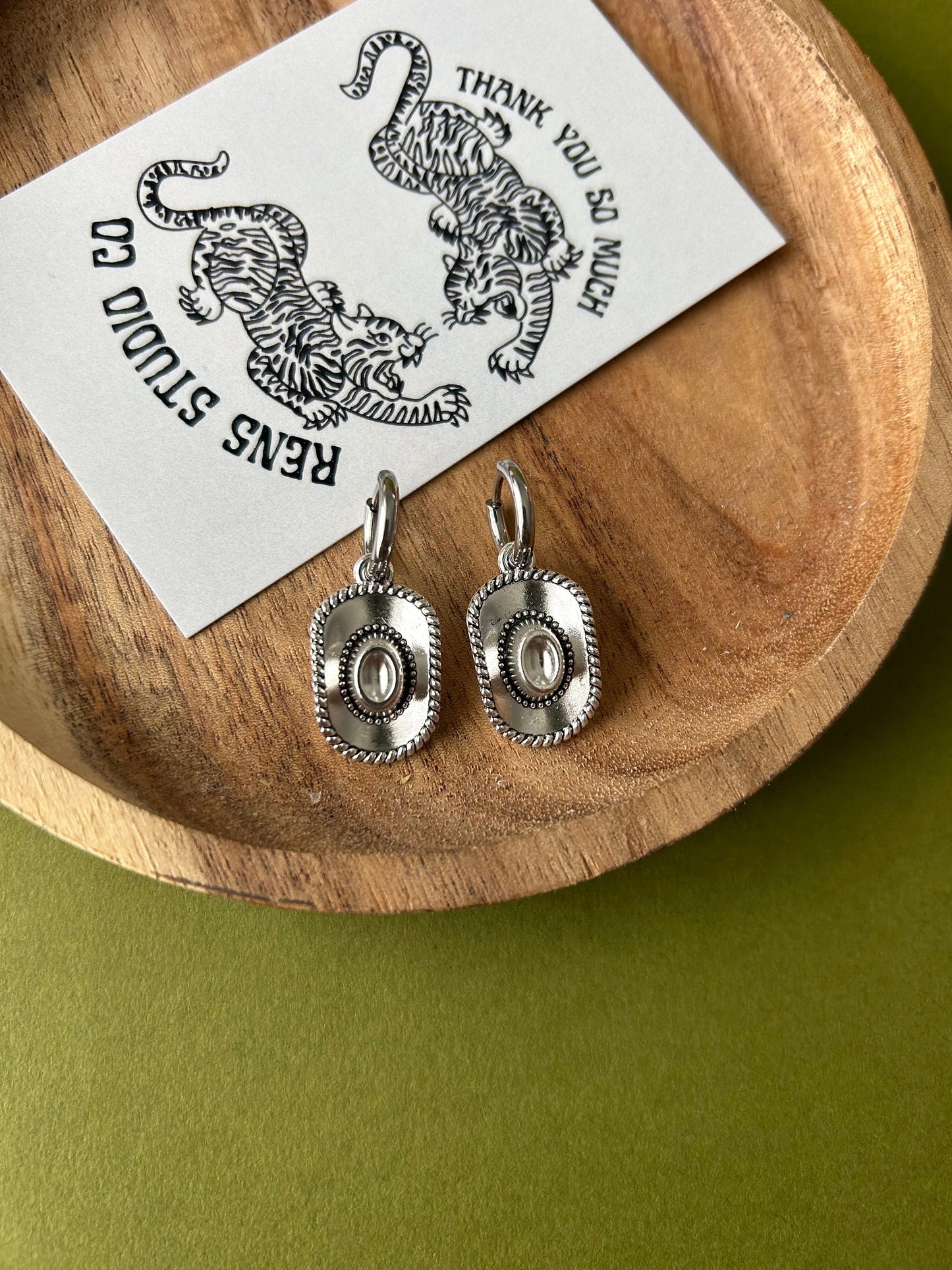 cowboy hat earrings | silver pair of hoop earrings