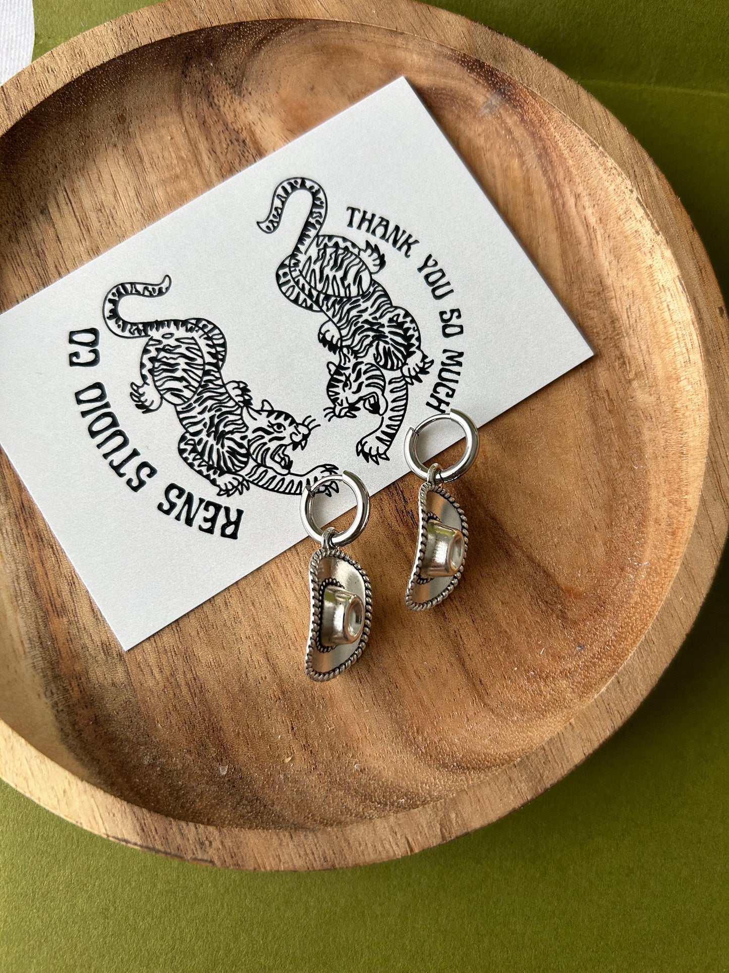 cowboy hat earrings | silver pair of hoop earrings